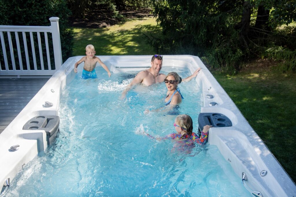 H2X Challenger 19D MAX swim spa, in a backyard setting