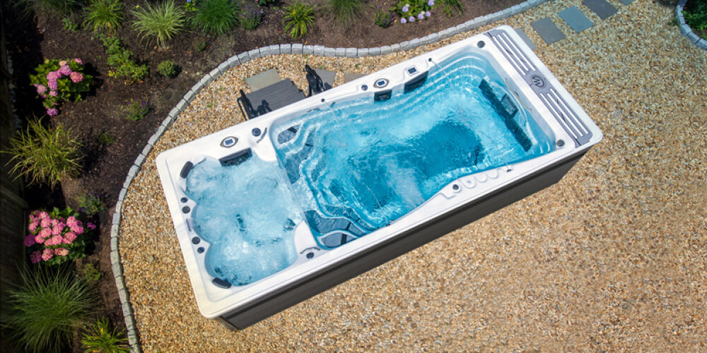 Michael Phelps Momentum D swim spa, in a backyard setting