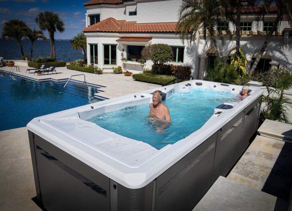 Michael Phelps Signature Pro swim spa, in a backyard setting