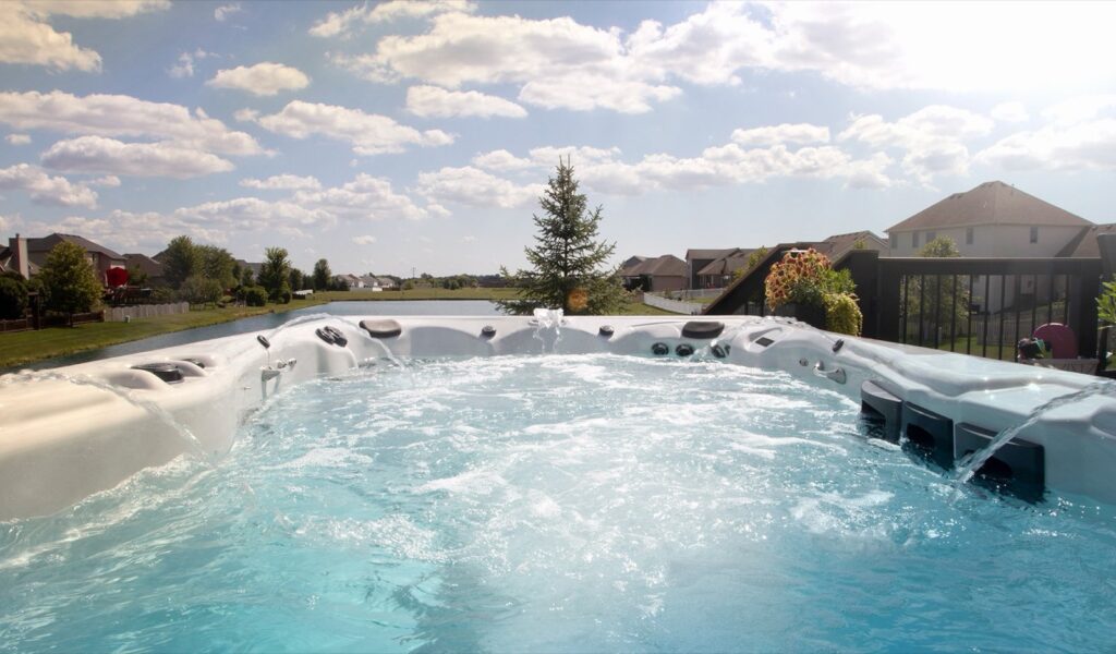 H2X Trainer 15D swim spa, in a backyard setting