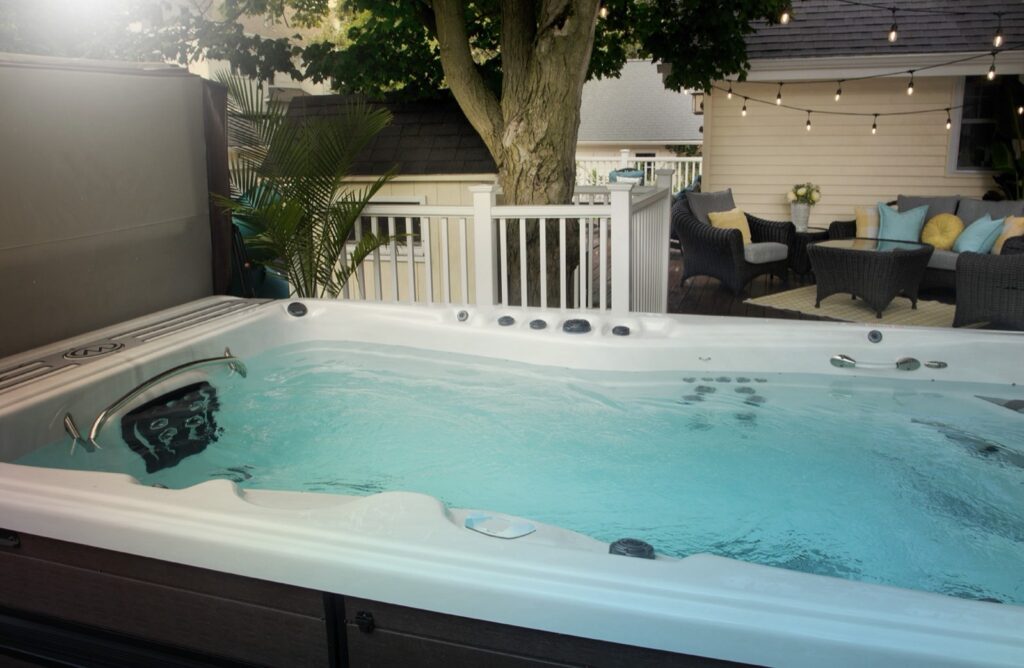 H2X Trainer 19D MAX swim spa, in a backyard setting