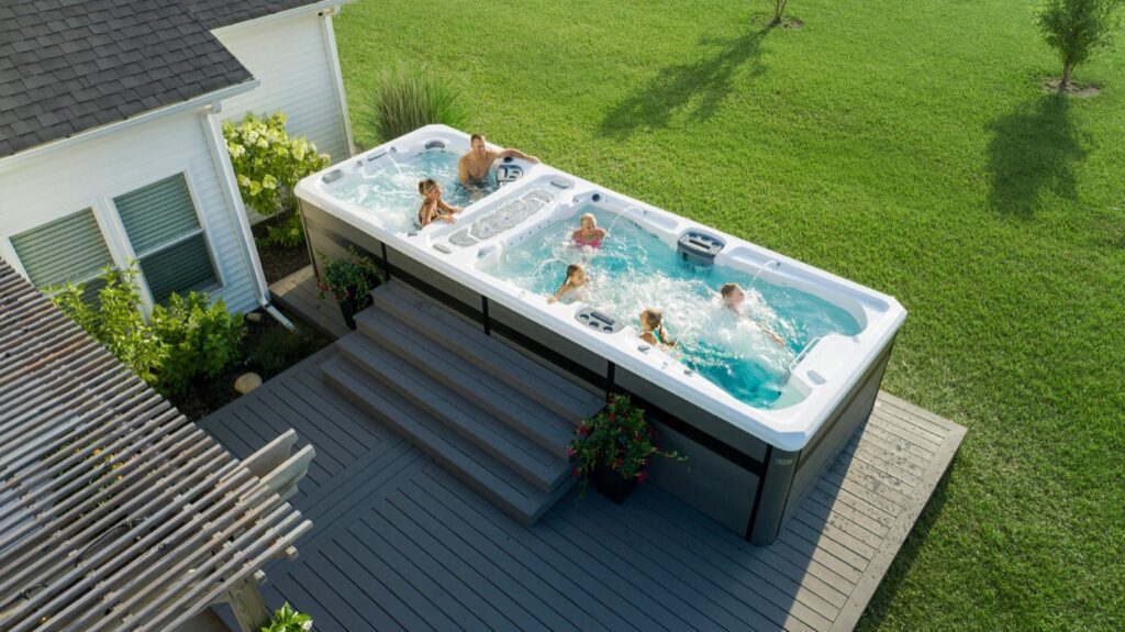 H2X Trainer 21 swim spa, family enjoying it together