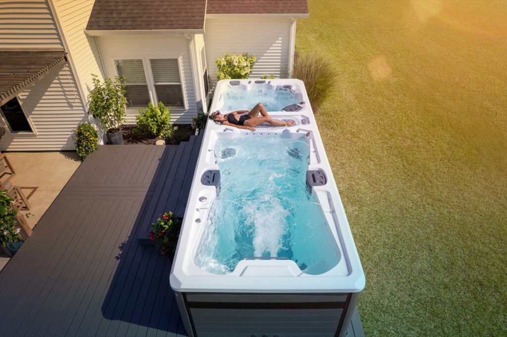 H2X Trainer 21D swim spa, in a backyard setting